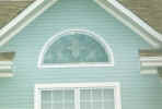 stained, beveled & brass circle top window