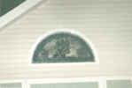 stained, beveled leaded circle top window