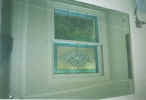 stained, beveled leaded double hung bath windows